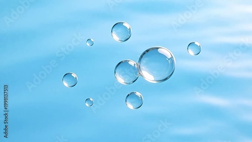 Bubbles floating in blue liquid