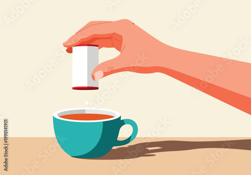 Hand holding a sweetener dispenser dropping a tablet into a cup of coffee or tea