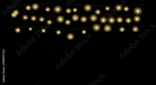 String lights in warm cozy glowing on black background for decoration