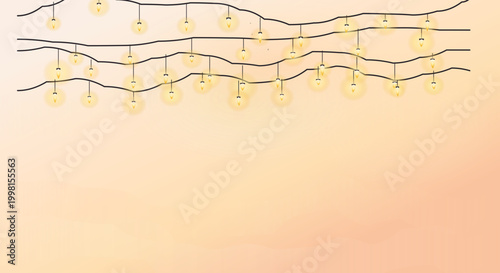 Warm string lights on black wire in soft gradient background for cozy ambiance