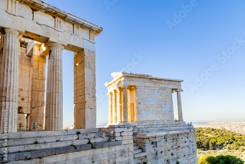 Fotografie The Acropolis: the Temple of Athena Nike and the columns of the south wing of the Propylaea