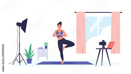 Fit woman practices yoga tree pose in her living room while filming a video for her online fitness vlog with professional equipment.