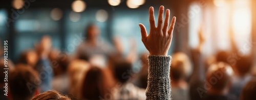 People raising hands during business seminar or workshop conference professional training education corporate skills development audience participation learning environment