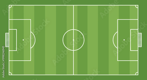 Football field with white markings on green striped surface for soccer