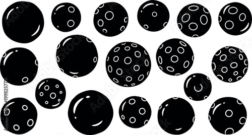 Collection of black spheres with white circular patterns and highlights circle