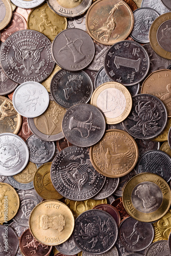 Canvas-taulu A background of silver, gold, and copper coins of various denominations