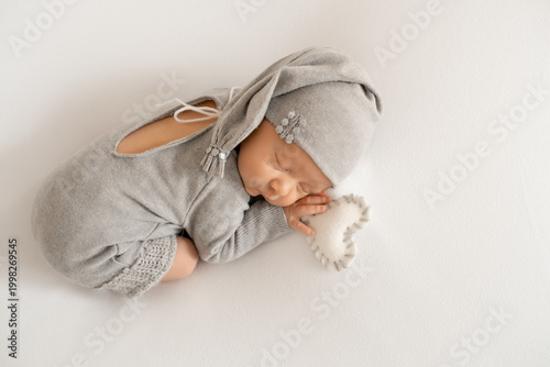 portrait of a sleeping newborn baby, space for text, a little baby sleeping peacefully