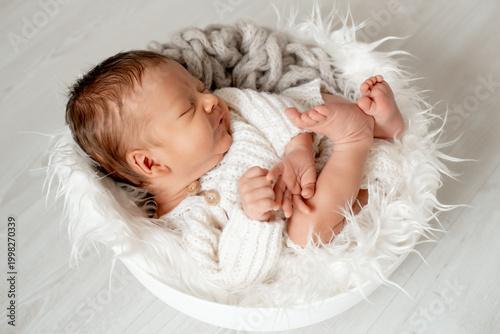 portrait of a sleeping newborn baby, space for text, a little baby sleeping peacefully