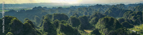 Tableau sur toile Aerial of dramatic Ninh Binh karst mountains, professional LinkedIn banner for tourism and conservation industry