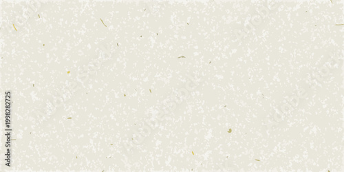 Cream colored textured surface with scattered debris