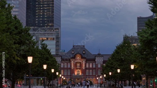 Twilight in Tokyo  :  As Lights Glow in the Historic Landmark Amidst Towering Skyscrapers, the Urban Center Pulses With the Rush Home  |  Tokyo Station, Tokyo, Japan