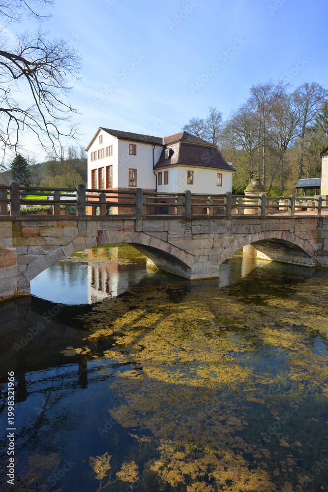 Fototapeta premium Kochberg Castle, view to the Theater building and moat, vertical view