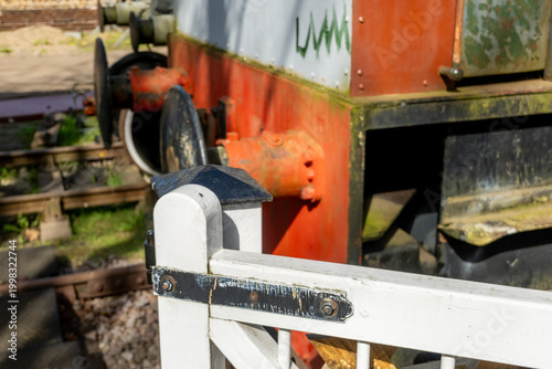 Photos Close and selective focus on a white gate post in a shunting yard