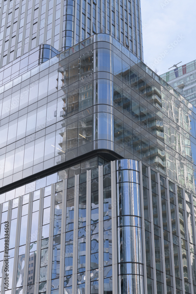 Fototapeta premium exterior of 19 Duncan, designed by Hariri Pontarini Architects--mixed-use integration of the heritage Southam Press Building and a modern 58-storey tower, housing Thomson Reuters offices