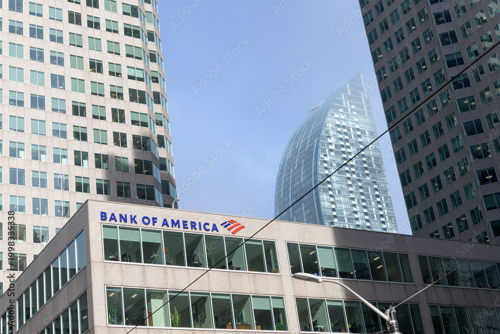 Fototapeta premium curved profile of L-Tower condominium and facade of Brookfield Place with Bank of America sign at 181 Bay St, Toronto 