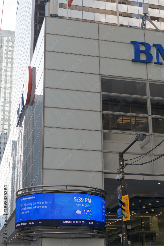 Fototapeta premium exterior of First Canadian Place, headquarters of BMO Group, with LED Financial Ticker or a Curved Ribbon Display, King and Bay, Toronto