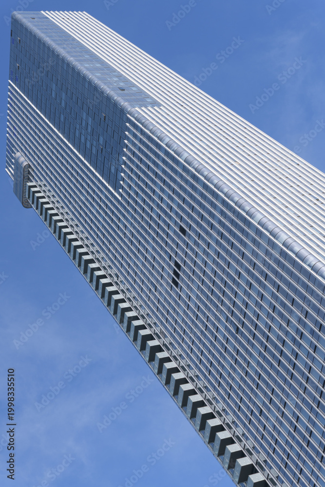 Obraz premium exterior of 19 Duncan, designed by Hariri Pontarini Architects - a modern 58-storey tower, housing Thomson Reuters offices, a luxury hotel, and residential units