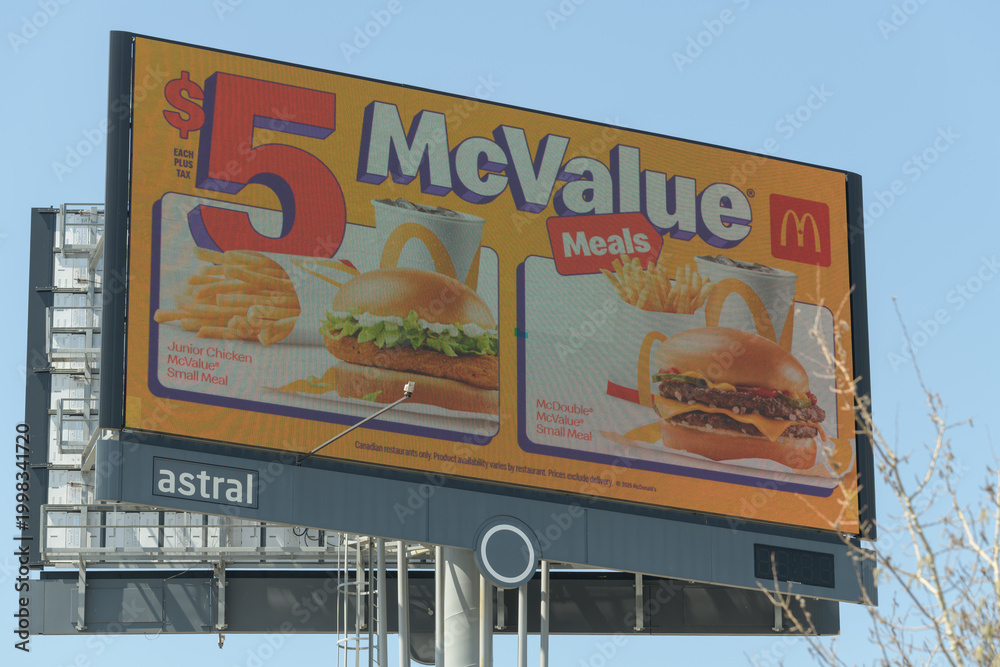 Fototapeta premium roadside pylon sign featuring advertising for $5 McValue Meals, McDonald's Canada fast food restaurant chain, Toronto