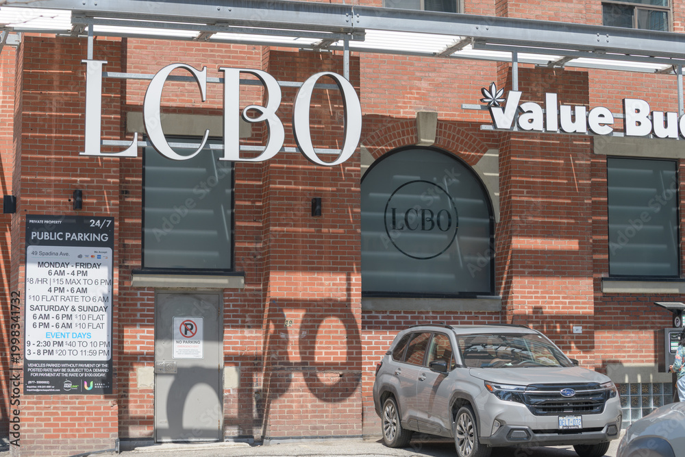 Naklejka premium suspended channel lettering signs at LCBO liquor store chain and Value Buds cannabis store located at 49 Spadina Av (parking area), Toronto
