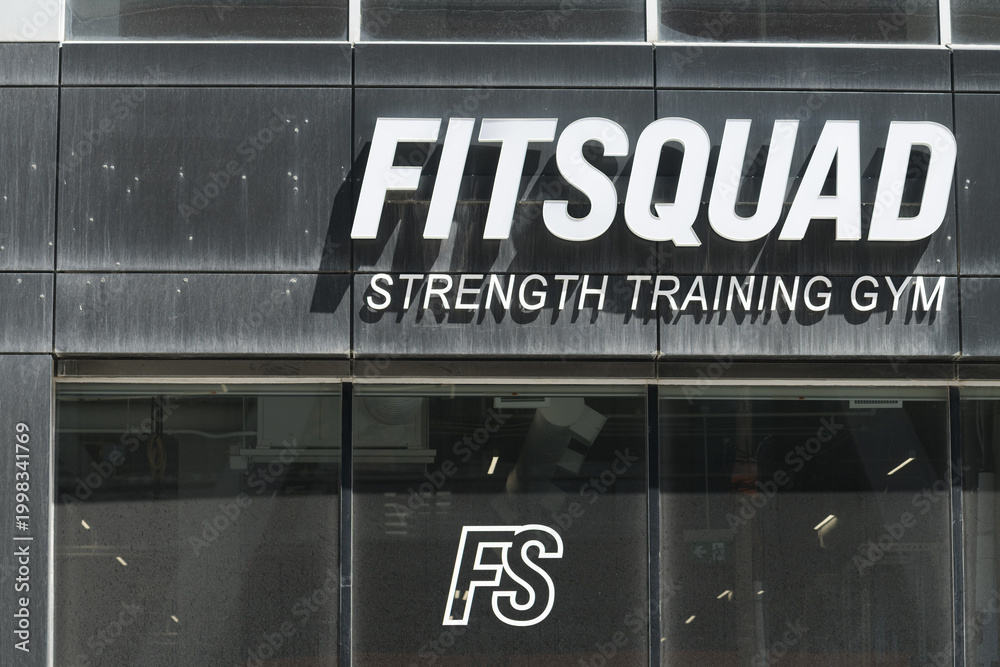 Fototapeta premium sign on the exterior of Fit Squad Training Gym located at 111 Peter St, Toronto