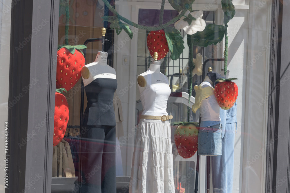 Fototapeta premium dressmaker forms with merchandise inside display windows at Aritzia, a women's clothing store, located here at 280 Queen St W, Toronto