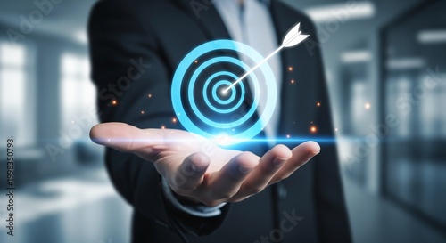 Businessman hand holding glowing target with arrow, business strategy concept