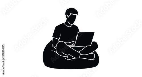 Man sitting with laptop on bean bag