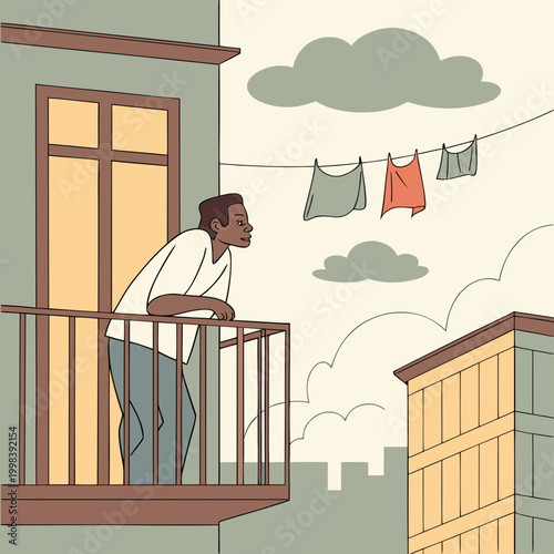 Man leans on balcony railing looking at city and laundry