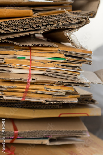 Stack of folded cardboard boxes neatly arranged for recycling, eco-friendly concept, waste management and sustainability