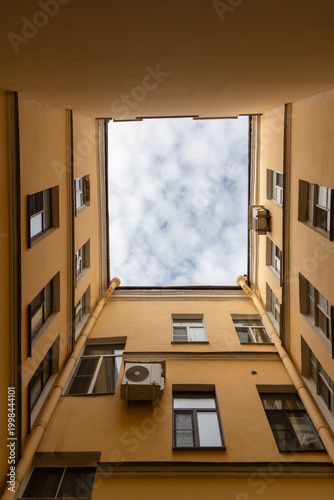 Building courtyard view in Saint Petersburg with sky above in cloudy weather