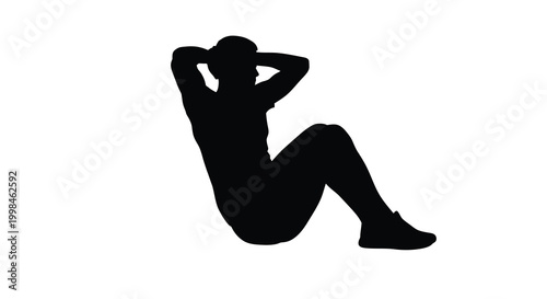 A person performing a sit up exercise in a dark silhouette