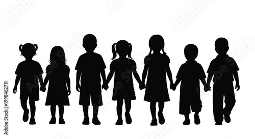 A line of children holding hands presented as a dark silhouette
