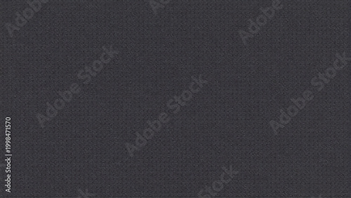 Dark gray textured fabric background close up view