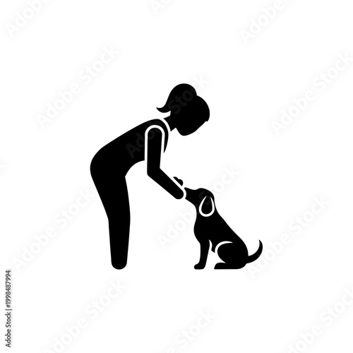 Silhouette of a woman petting a sitting dog