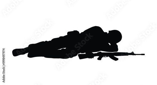 Soldier lying down with a rifle.