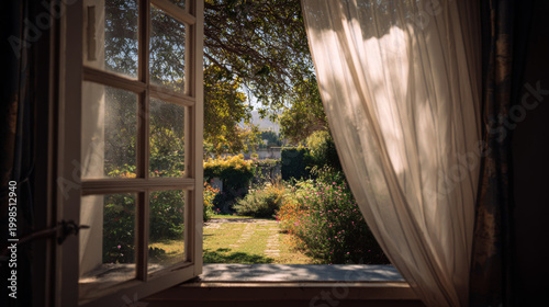 Calm garden view through an open window with sheer curtains swaying. 