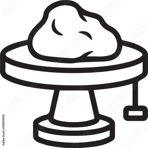 pottery wheel with clay lump attached