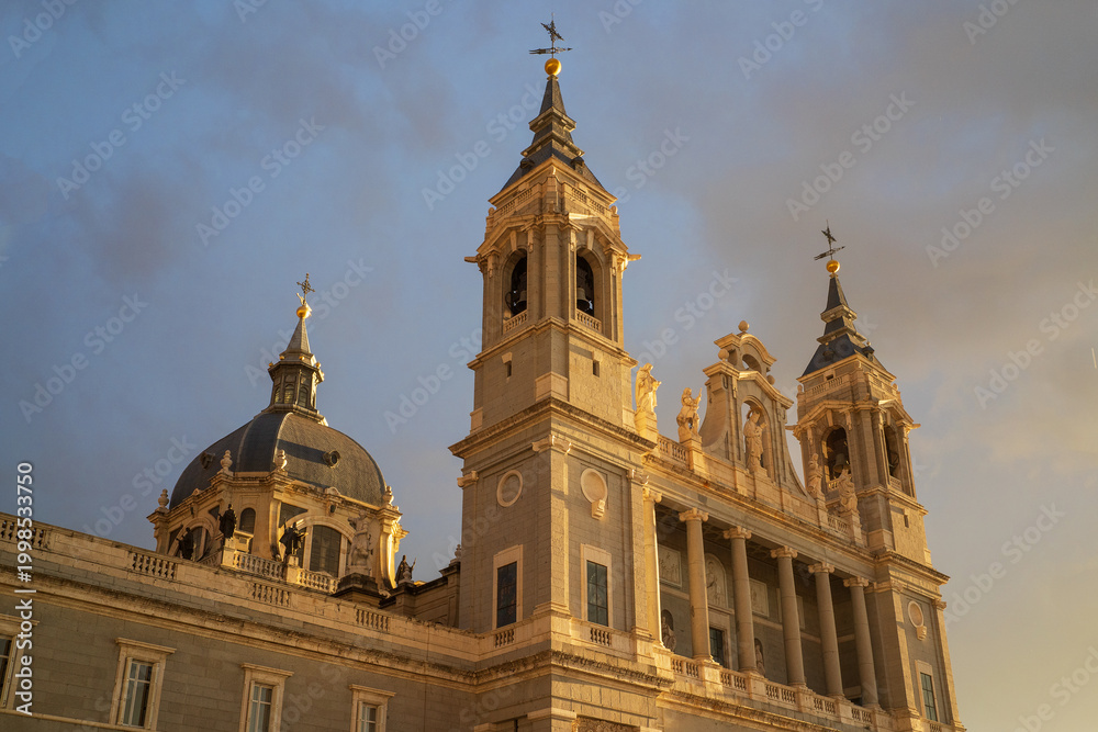 Fototapeta premium Madrid, Spain -April 04, 2026: The cathedral of Santa María La Real de La Almudena. The cathedral building in the evening