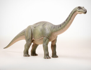 Realistic green dinosaur model standing against a white background, ancient reptile representation