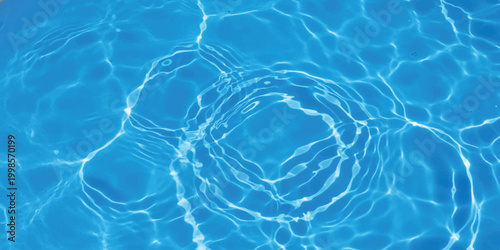 Abstract water ripples and waves moving in bright blue liquid surface