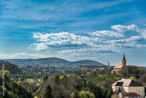 Schilderij op canvas Landscape with bridge church and hills under blue sky in Veszprem
