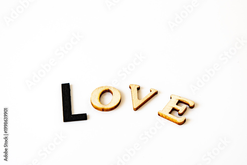 Konstfotografi valentines message love in wooden letters the type L is black and bigger than th