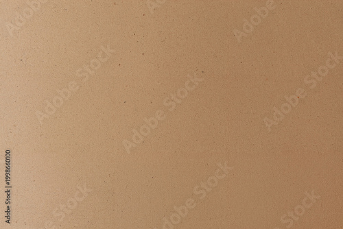 Schilderij op canvas Seamless natural brown cardboard surface displays a fine granulated texture with scattered small particles