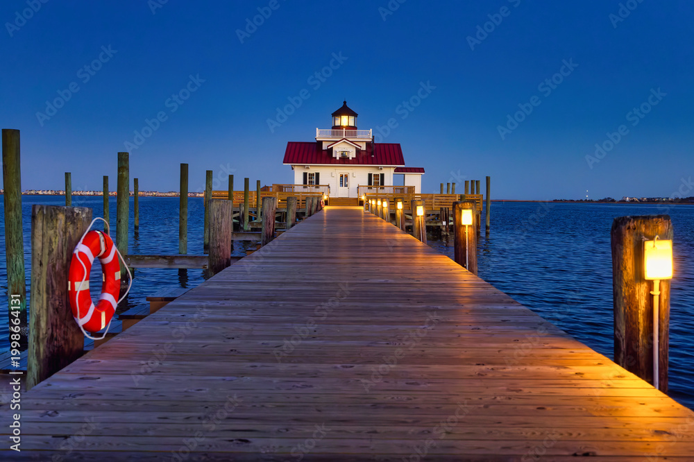 Fototapeta premium A nightscape photo of the Roanoke Marshes Lighthouse in Manteo, North Carolina in the Eastern United States
