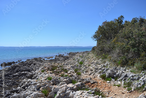 Rocky coastline of Kozino with clear blue Adriatic Sea, Zadar region, Croatia