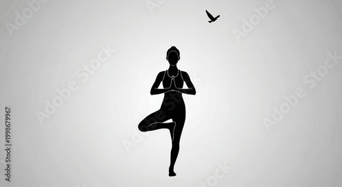 Silhouette of a woman in tree pose with a bird in flight overhead