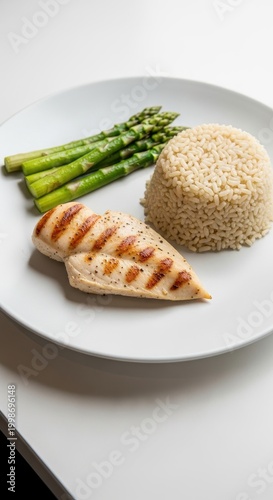 Grilled Chicken Breast with Asparagus and Brown Rice.