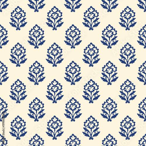 Indian block print seamless pattern with small ikat floral motifs arranged in neat grid on warm cream background traditional hand carved woodblock textile design.