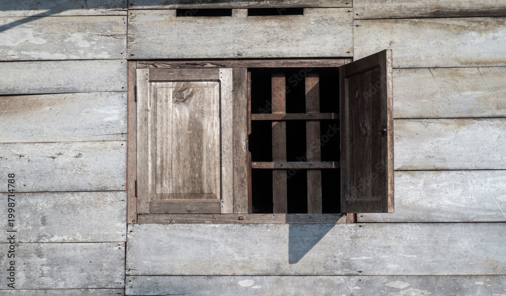 Fototapeta premium old wooden window on vintage house