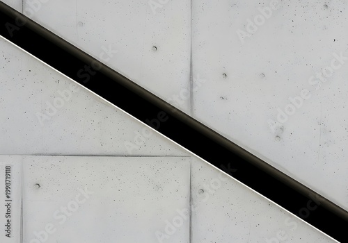 Close-up of Black Metal Handrail on White Wall.